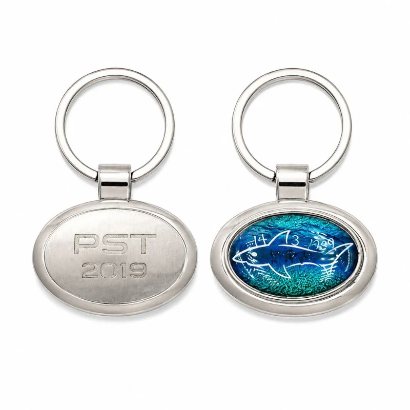 Móc oval với mặt PST 2019 và mặt hình cá nền xanh